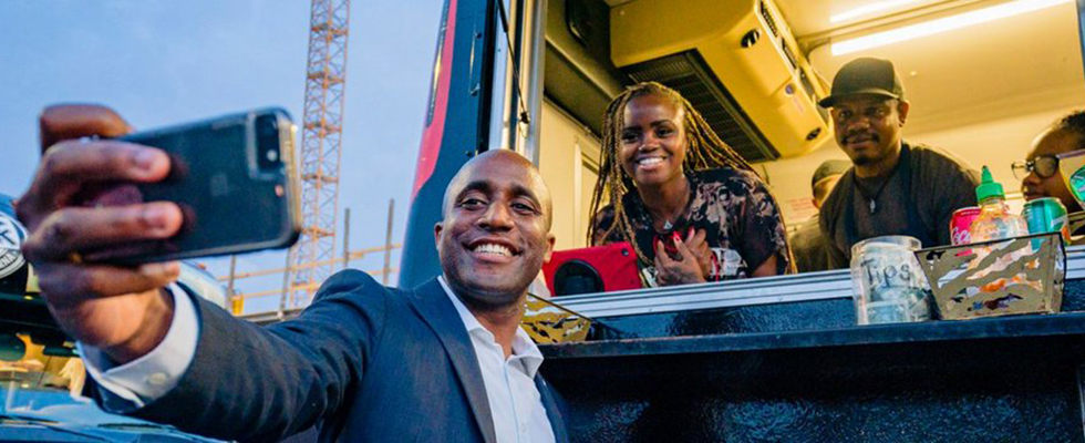 Mayor Lucas taking a selfie with residents